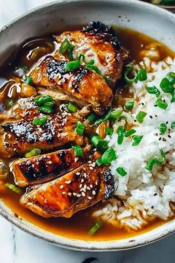 Delicious caramelised soy chicken in garlic ginger broth with rice
