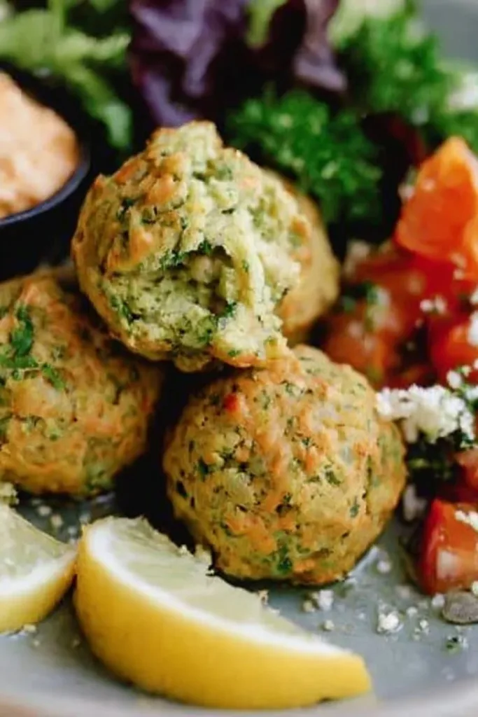 Plate of gluten-free falafel served with fresh salad and dipping sauce