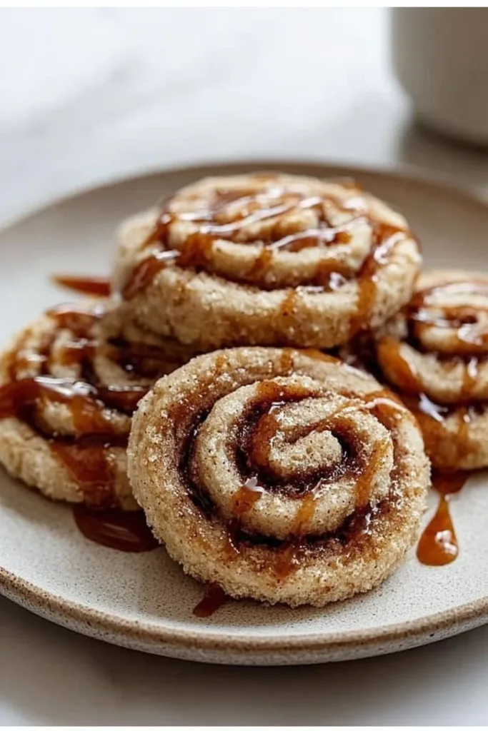 Amazing vegan gluten-free cinnamon roll cookies on a plate.