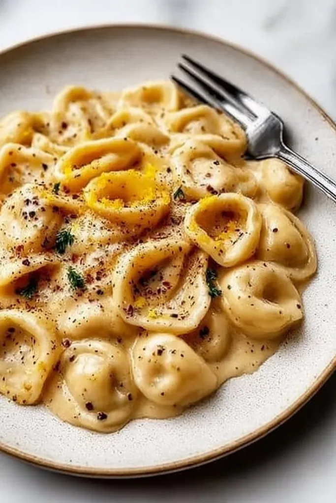 Creamy Roast Garlic and Lemon Pasta Sauce: An Incredible Ultimate Recipe 2 Creamy roast garlic and lemon pasta sauce in a bowl with fresh herbs