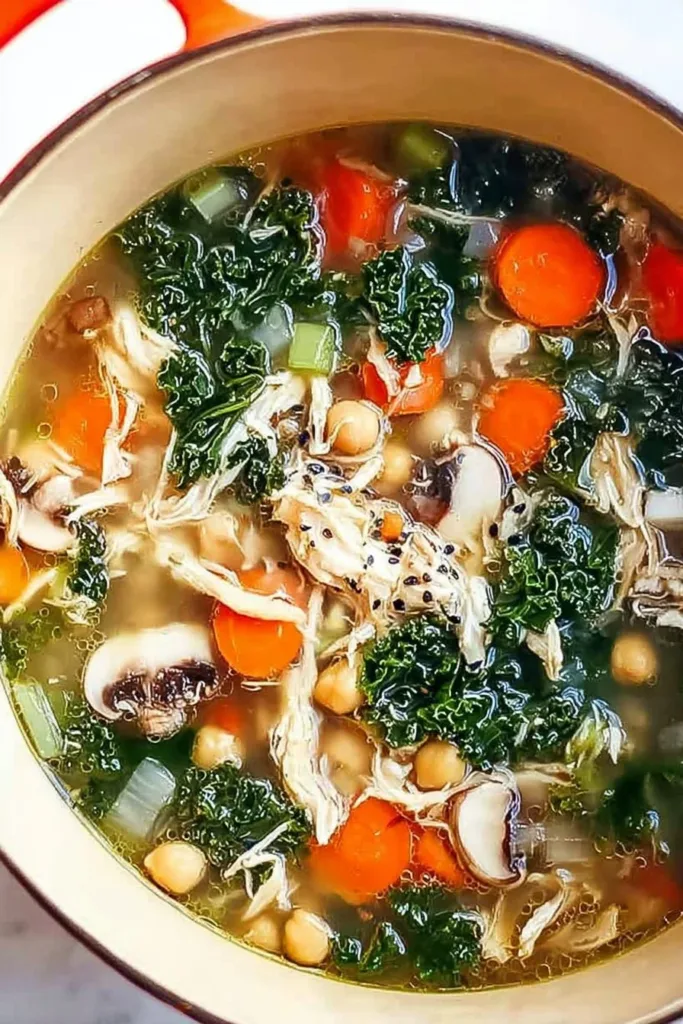 Detox Immune-Boosting Soup 3 Bowl of Detox Immune-Boosting Soup with fresh vegetables and herbs