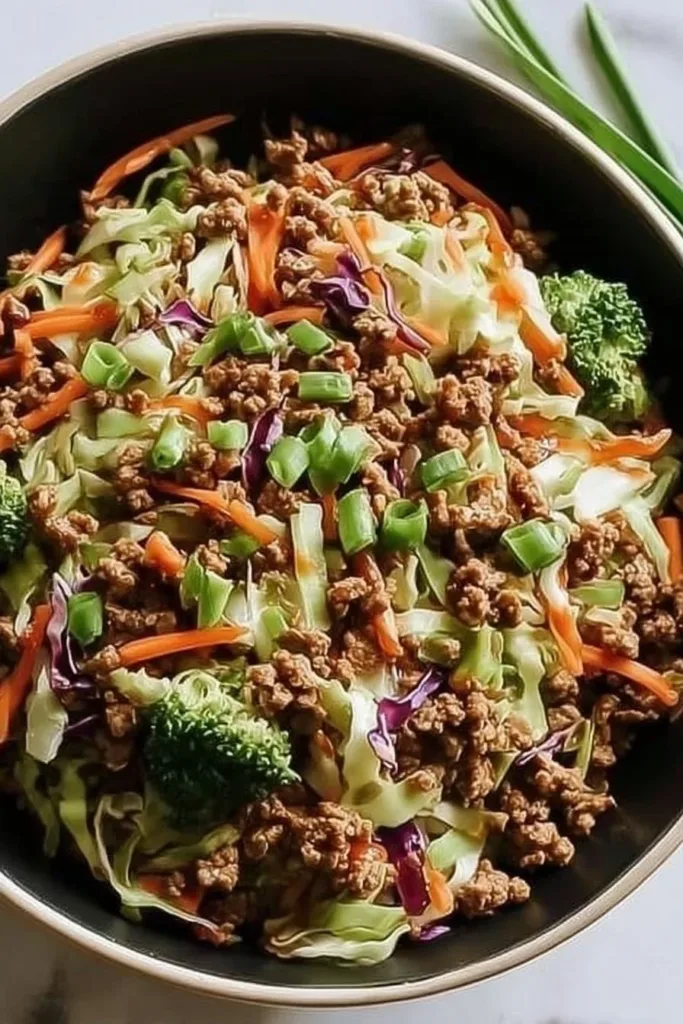 High protein egg roll in a bowl with colorful vegetables and savory sauce