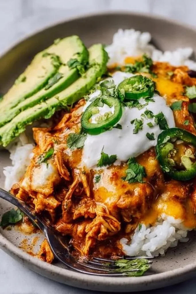 Delicious slow cooker chicken enchiladas on a plate ready for a family dinner
