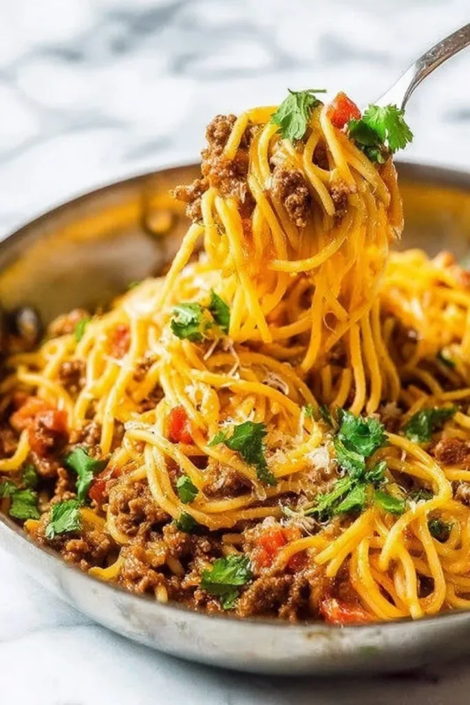 One Pot Taco Spaghetti 2 One Pot Taco Spaghetti dish with colorful toppings served in a bowl