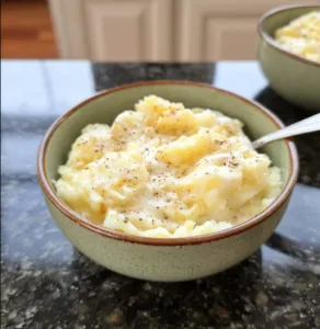 Delicious serving of Amish Wedding Potatoes with creamy sauce and toppings.