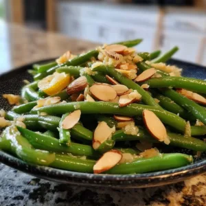 Classic Green Bean Almondine 2 Plate of classic green bean almondine garnished with almonds