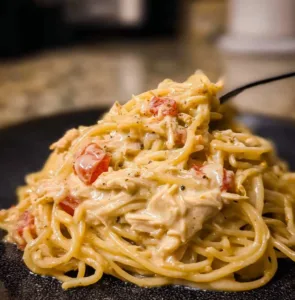 Cozy Crock Pot Cheesy Chicken Spaghetti Delight 2 Crock Pot Cheesy Chicken Spaghetti Delight served in a bowl