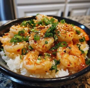 Delicious Garlic Butter Shrimp Rice Bowl with fresh herbs and spices