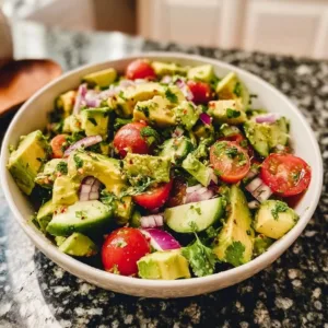Delicious avocado salad with fresh vegetables and dressing
