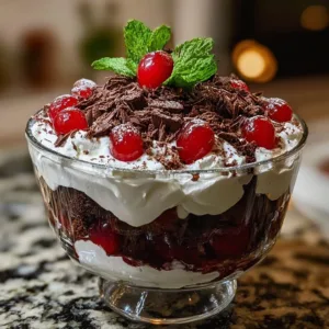 Delicious Black Forest brownie trifle with layers of brownies and cherries