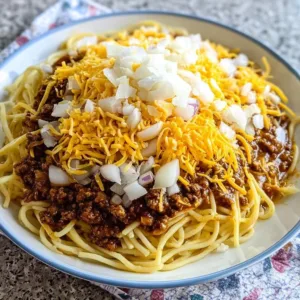 Bowl of Cincinnati-Style Chili topped with cheese and onions