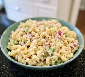 Classic Macaroni Salad 3 Bowl of classic macaroni salad with vegetables and dressing
