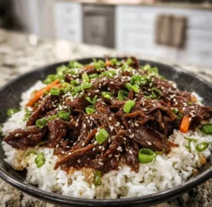 Plate of sizzling Korean BBQ with grilled meat and vegetables for a cozy night.