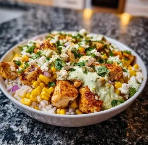 Street Corn Chicken Rice Bowl with chicken, corn, and rice in a vibrant dish