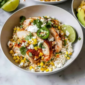 Delicious chicken with street corn and rice served on a plate.