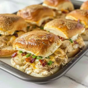 Crack Chicken Sliders 3 Delicious Crack Chicken Sliders served on a platter