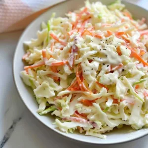 Bowl of homemade creamy coleslaw with fresh ingredients and dressing