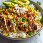 Delicious Street Corn Chicken Rice Bowl topped with fresh ingredients and vibrant colors.