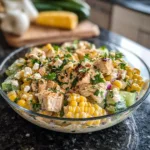 Creamy cucumber chicken salad with street corn, served in a bowl.