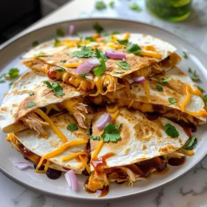 BBQ Chicken Quesadillas: Easy & Delicious Dinner Idea 3 Delicious BBQ Chicken Quesadillas served on a plate with dipping sauce.