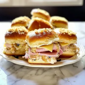 Chicken Cordon Bleu Sliders 3 Chicken Cordon Bleu Sliders served with dipping sauce and garnished with herbs