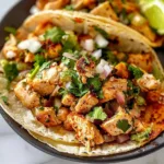 Delicious Chicken Street Tacos with fresh toppings on a wooden table