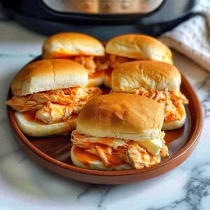 Instant Pot Buffalo Chicken Sliders 3 Instant Pot Buffalo Chicken Sliders ready to serve on a platter