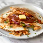 Delicious quick BBQ chicken quesadillas served with sauce