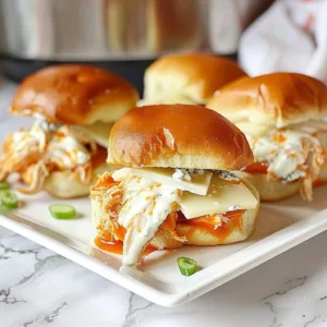 Slow Cooker Buffalo Ranch Chicken Sliders 3 Slow cooker buffalo ranch chicken sliders served on a platter
