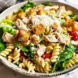 Delicious Chicken Caesar Pasta Salad served in a bowl with fresh ingredients.