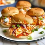 Slow Cooker Buffalo Chicken Sliders served on a platter with sauces